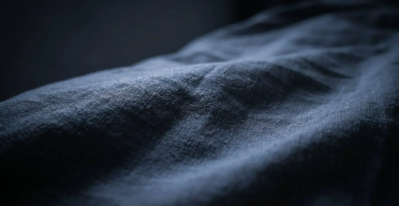 Close-up macro detail of sleep disruption concept through tactile bedroom textures